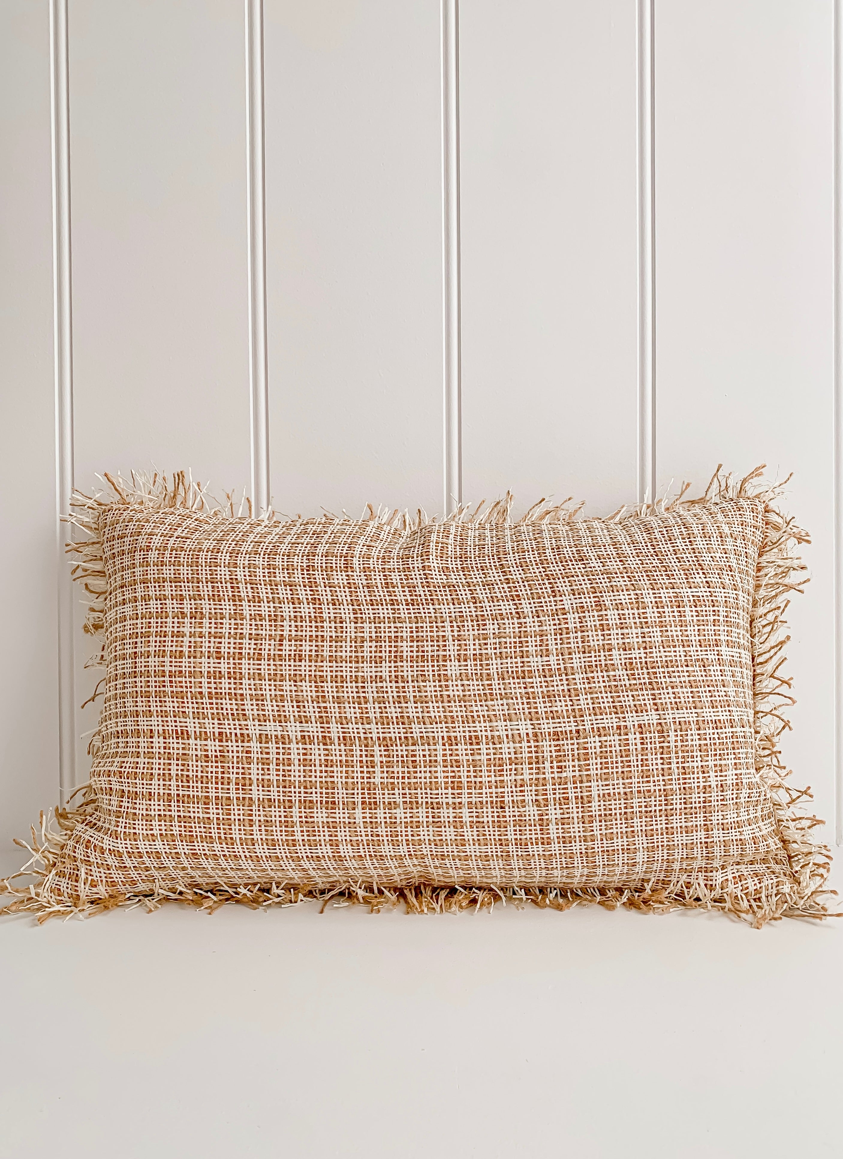 A Ava | Weave cushion by Barre Living, tan and beige jute pillow with elegant fringes.